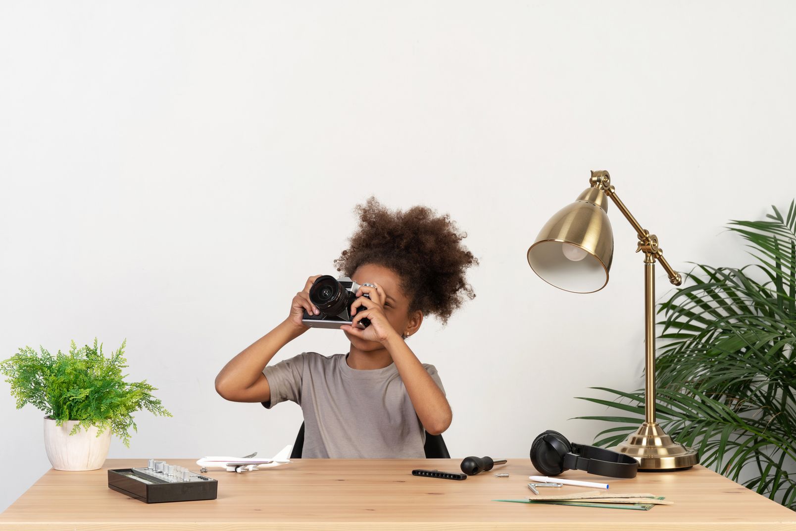 Why Photography and Videography Matter for Your Website: Girl taking a shot