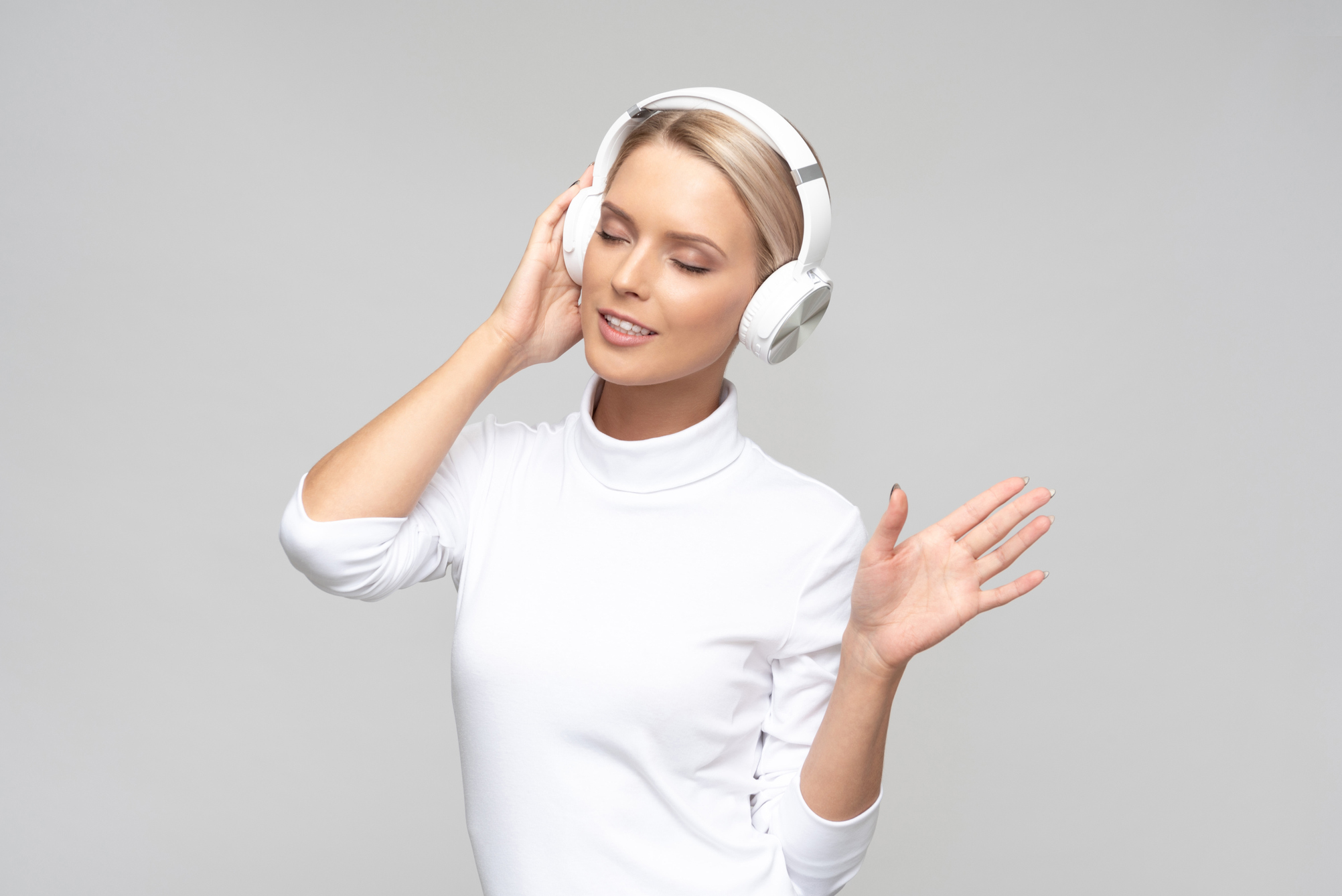 Photo of a young girl who listens to the music and dances